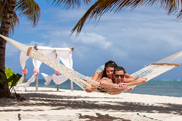 istock Romantic Couple Relaxing In Beach Hammock 478848958