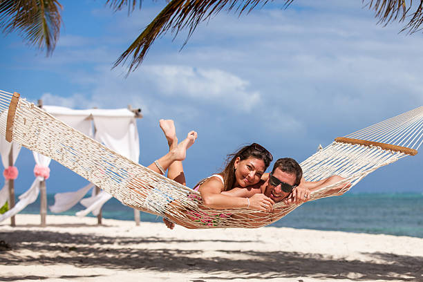 istock Romantic Couple Relaxing In Beach Hammock 478849300