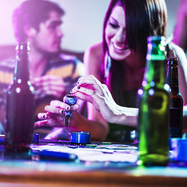 istock girl packing a pipe with drugs 478849741