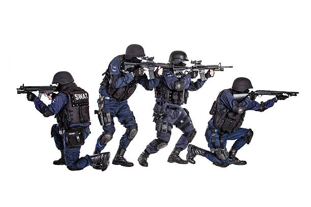 SWAT team in action Special weapons and tactics (SWAT) team in action gun laws stock pictures, royalty-free photos & images