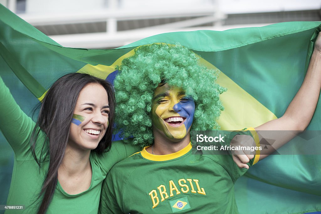 Couple watching a Brazilian Football Game. Couple watching a Brazilian Football Game, World Cup Fan - Enthusiast Stock Photo