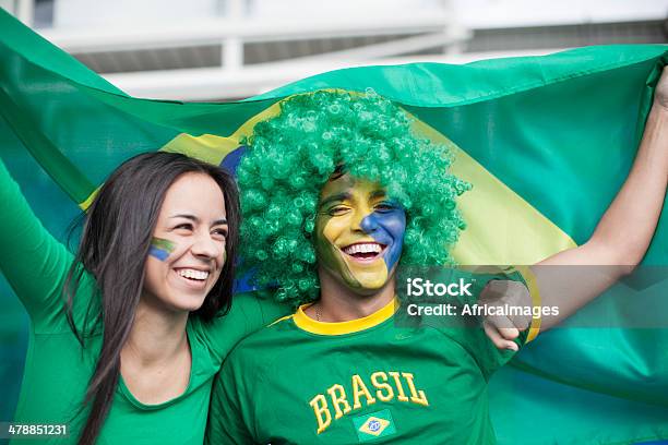 Couple Watching A Brazilian Football Game Stock Photo - Download Image Now - Fan - Enthusiast, International Soccer Event, Couple - Relationship