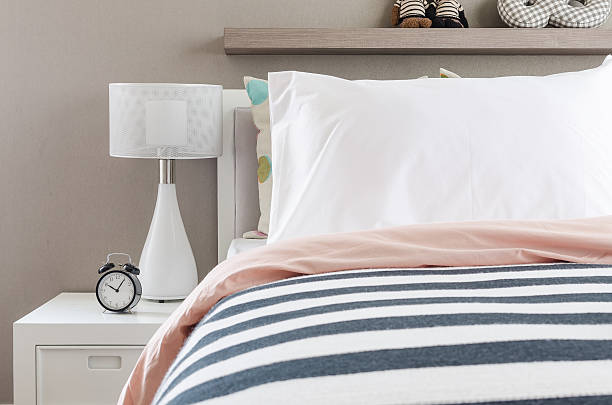 istock kid's bedroom with white pillows and lamp on modern bed 478851418