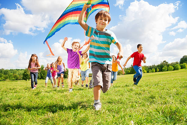 istock Many kids run with kite 478851875