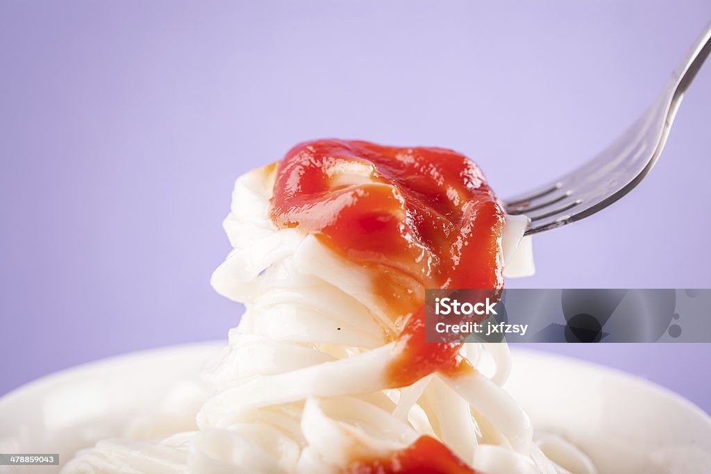 ketchup with noodle ketchup with noodles with purple background Backgrounds Stock Photo