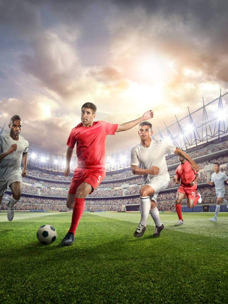 istock Soccer player kicking ball in stadium 478859234