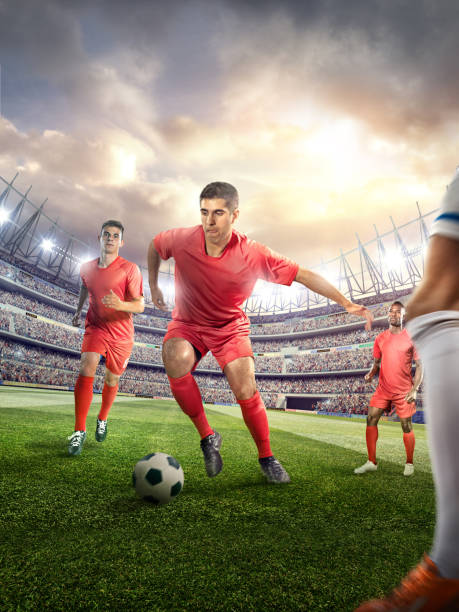 istock Soccer player kicking ball in stadium 478859236