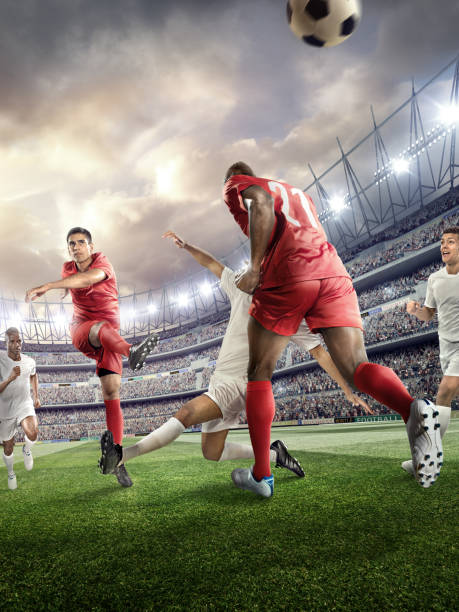 istock Soccer player kicking ball in stadium 478859240