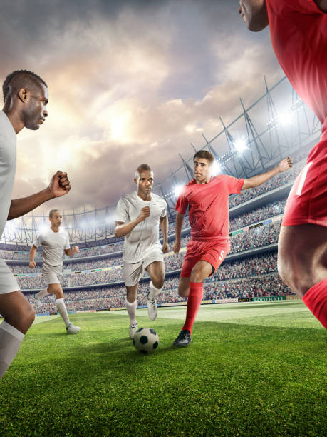 istock Soccer player kicking ball in stadium 478859242