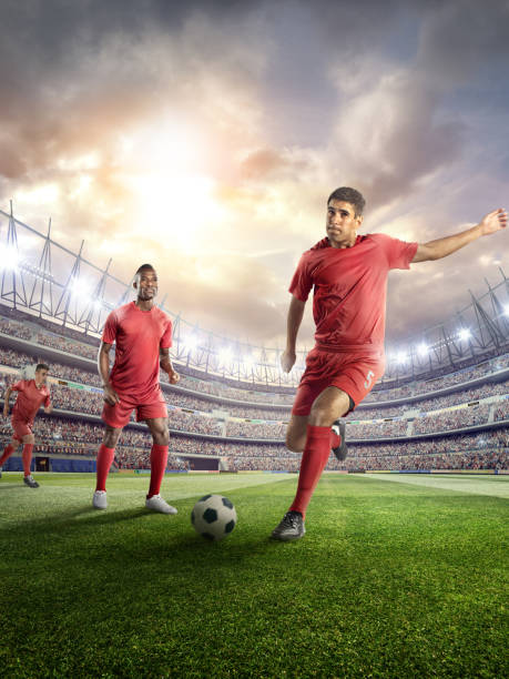 istock Soccer player kicking ball in stadium 478859246