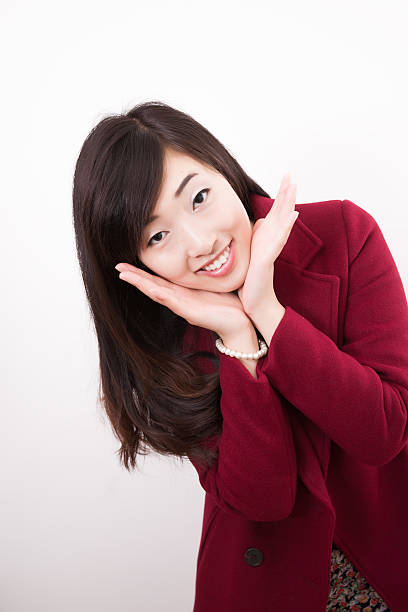 istock Beautiful asian woman applying her make-up 478859265