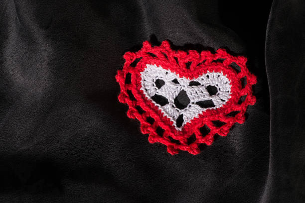 istock Heart shape made of red textile 478859437