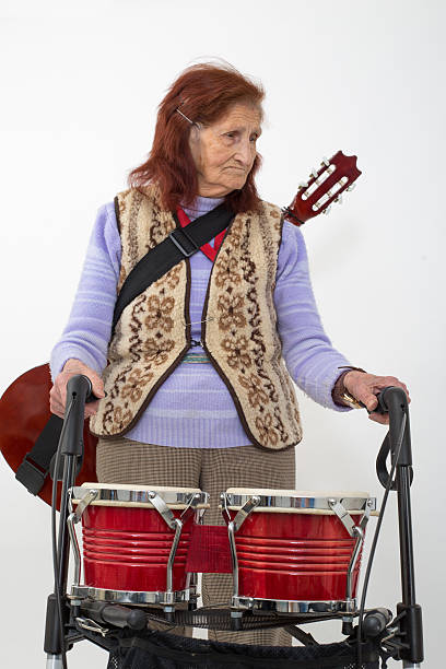 istock Elderly lady with rollator and musical instruments 478860208