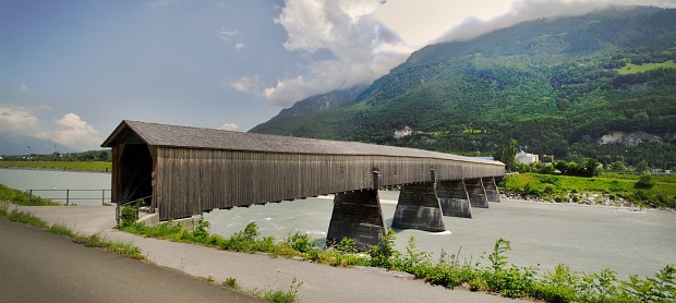 old wooden bridge over Rhein that connect Liechtenstein to Switzerland