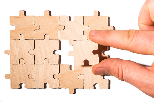 istock Wooden puzzle on white background. Close up 478861125