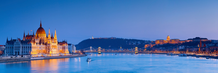 Panoramic image of Budapest, capital city of Hungary, during twilight blue hour. This is composite of three horizontal images stitched together in photoshop.
