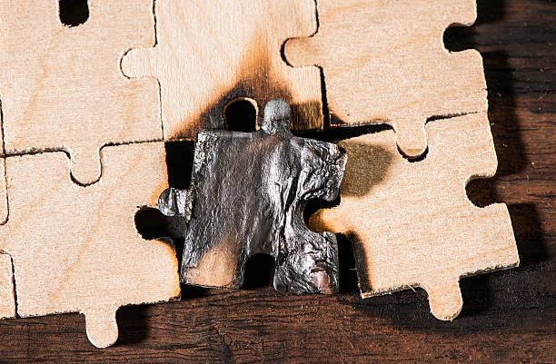 istock Burning wooden puzzle on dark background. 478862813