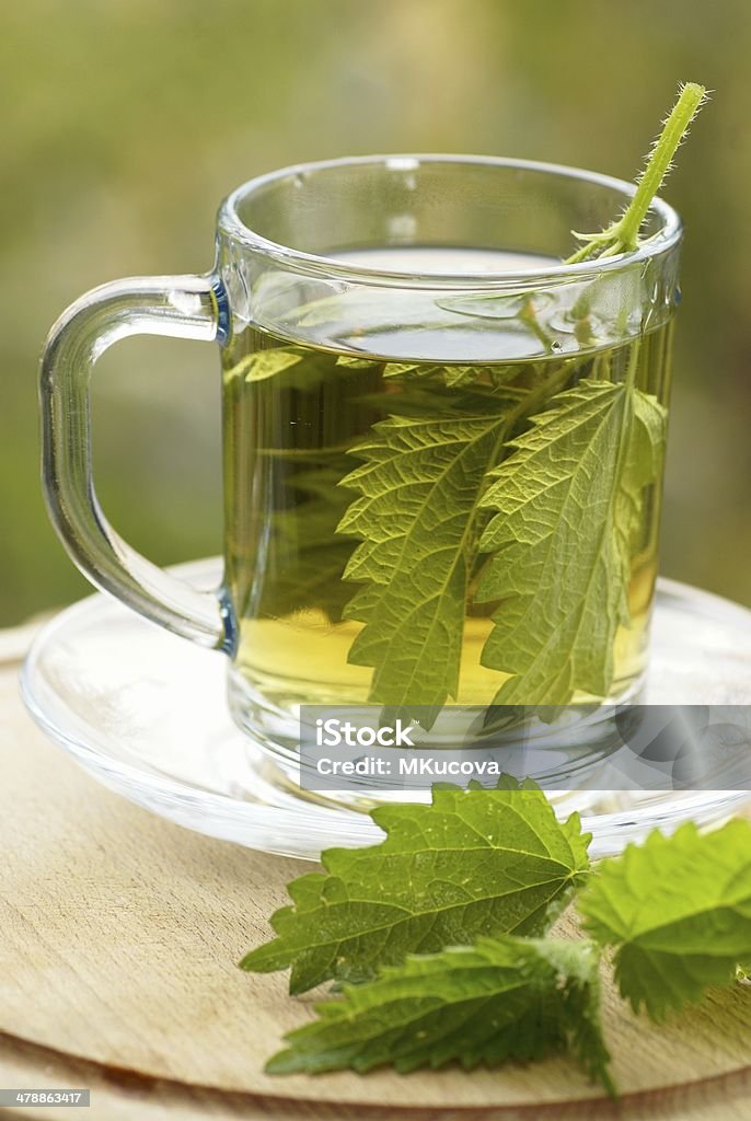Nettle tea Nettle tea in glass. Alternative Medicine Stock Photo