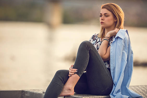 istock Young pensive woman relaxing during the day. 478864180