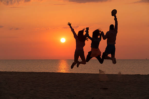 istock Group of People Celebrating on the beach 478864252
