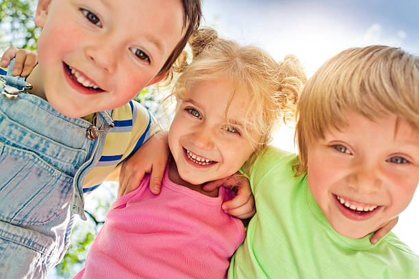 istock Three happy children in summer 478864486