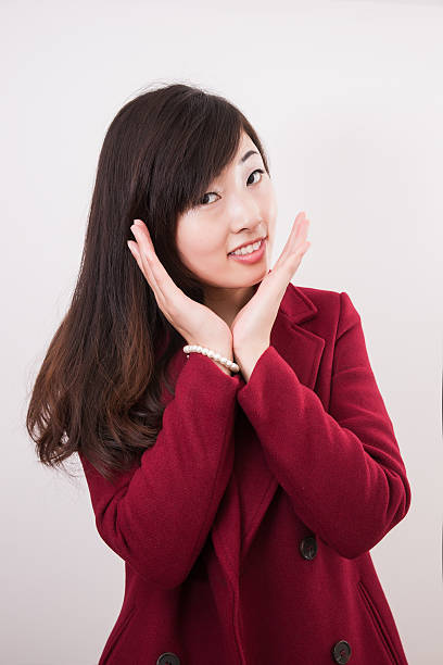 istock Beautiful asian woman applying her make-up 478865945