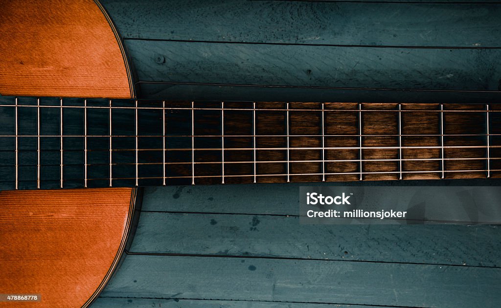 Guitar guitar,  blue wood background Country and Western Music Stock Photo