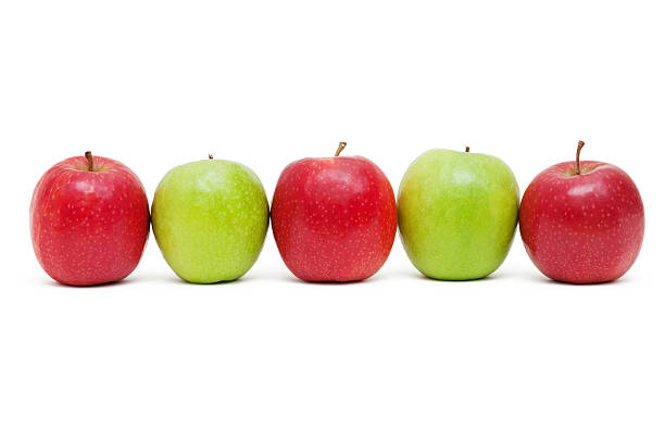 istock Green and Red apples in a row isolated on white 478869571