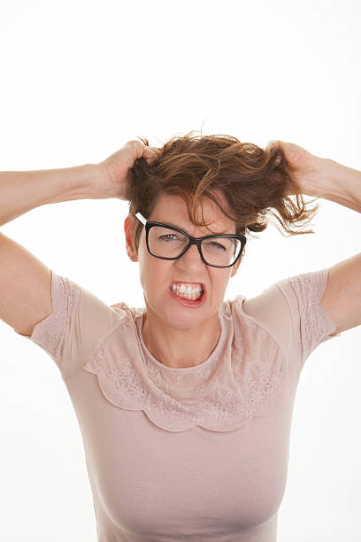 istock frustrated woman hands to head 478873809