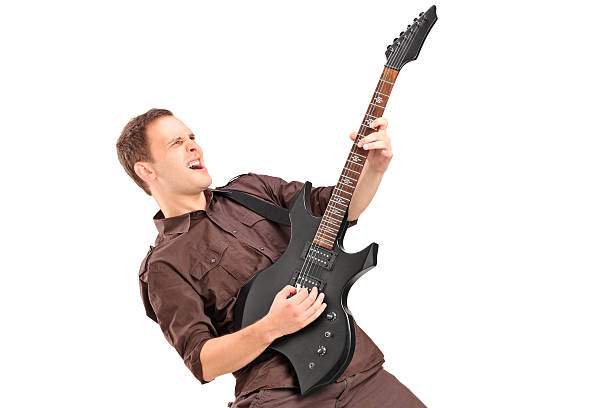 istock Young man playing on electric guitar 478878231