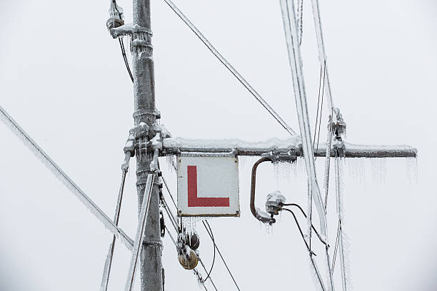 istock Frozen electrical lines for railroad with icicles 478878405