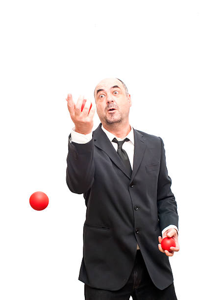 istock Businessman that is juggling with a red balls 478878934