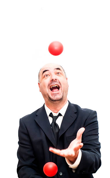 istock Businessman that is juggling with a red balls 478878954
