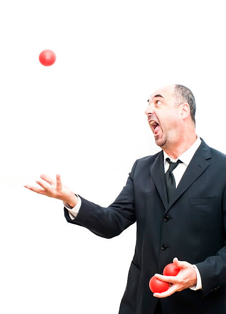 istock Businessman that is juggling with a red balls 478878962