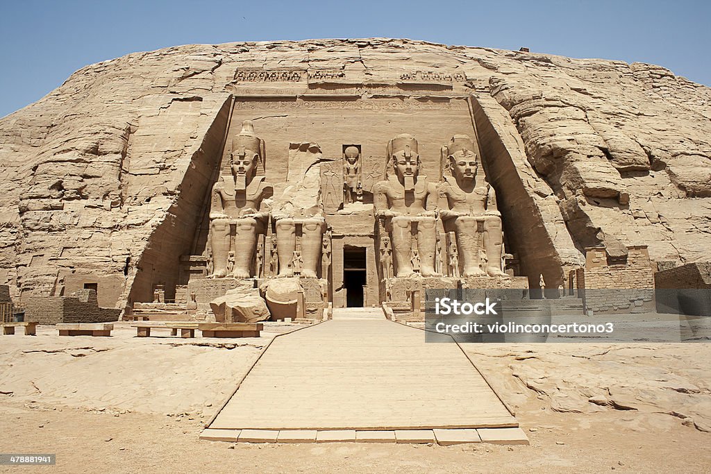 The Great Temple, Abu Simbel , Egypt The Abu Simbel temples are two massive rock temples in Abu Simbel  in Nubia, southern Egypt. They are situated on the western bank of Lake Nasser, about 230 km southwest of Aswan. The complex is part of the UNESCO World Heritage Site known as the "Nubian Monuments" which run from Abu Simbel downriver to Philae (near Aswan). Great Temple of Rameses II Stock Photo