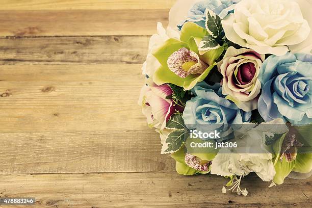 Artificial Flowers On Wooden Background Vintage Effect Stock Photo - Download Image Now