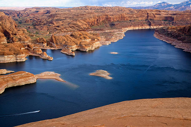 Boating on Lake Powell Boating on Lake Powell - Hole in the Wall Lake Powell - Scenic view at historic site.  Escalante, Utah USA. lake powell stock pictures, royalty-free photos & images