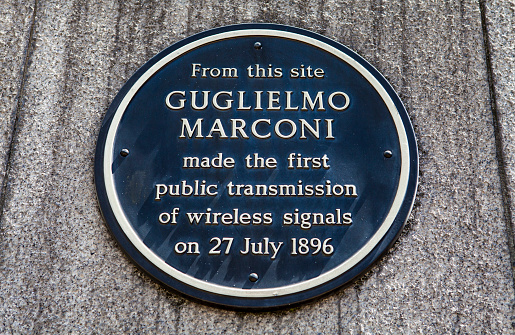 London, UK - June 18, 2015: A plaque in Newgate Street, London marking the location where Guglielmo Marconi made the first public transmission of wireless signal, - taken in London on 18th June 2015.