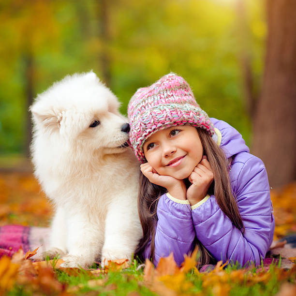 istock Child and puppy 478884910