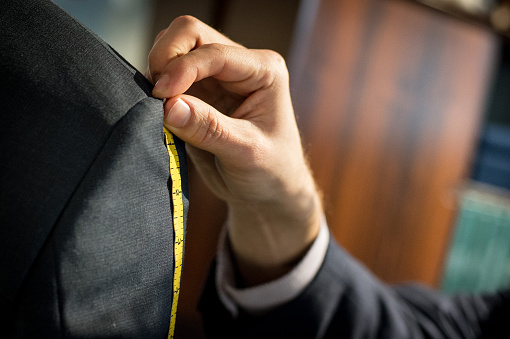 Measurement of shoulder for a suit fitting