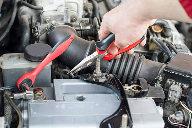 istock The process of repairing vehicle using pliers 478887586