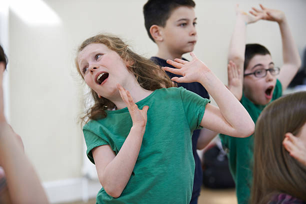 istock Group Of Children Enjoying Drama Class Together 478887636