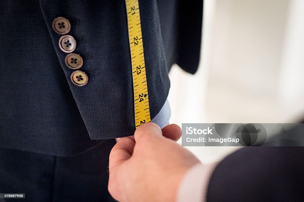 Tailoring Measurement of sleeve for a suit fitting Tailored Clothing Stock Photo