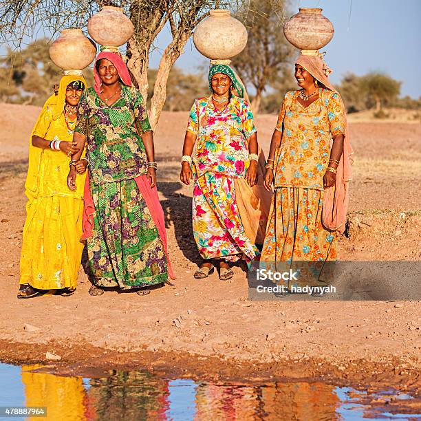 Indian Women Carrying Water Rajasthan Stock Photo - Download Image Now - 2015, Adult, Adults Only