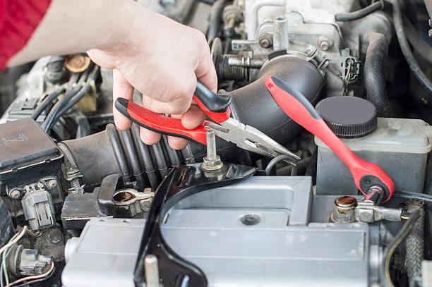 istock The process of repairing vehicle using pliers 478888292
