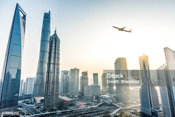 Plane Fly Over City Stock Photo - Download Image Now - China - East Asia, Airplane, City