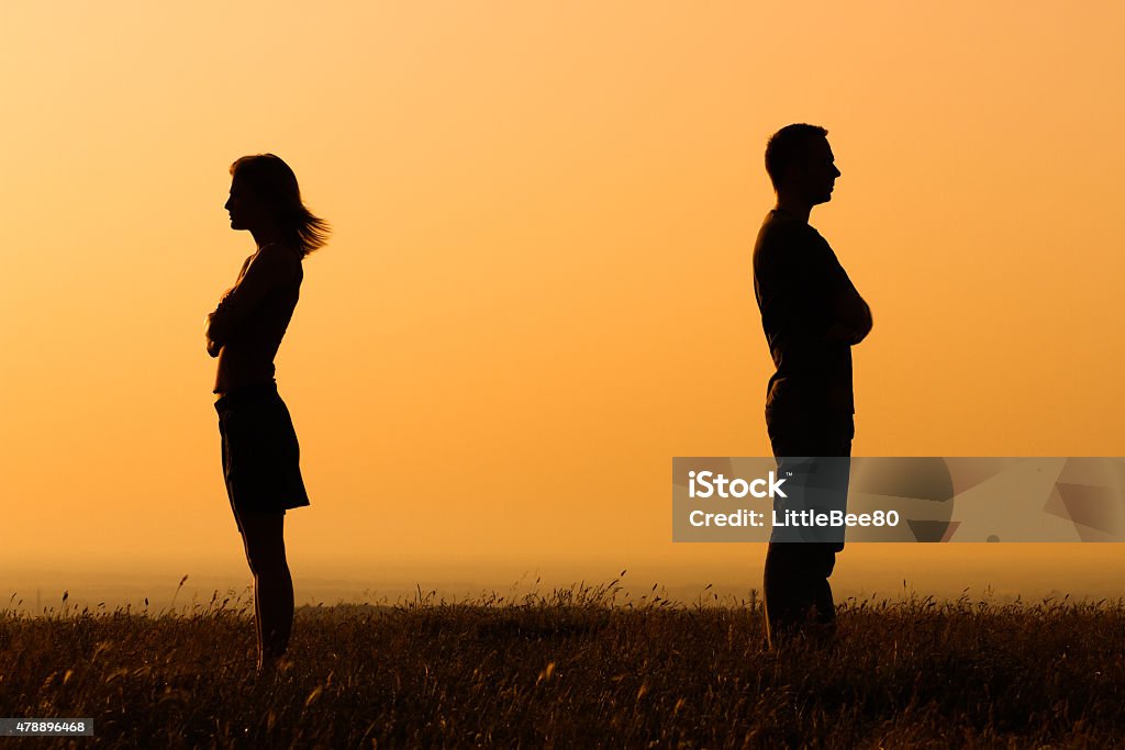 Relationship difficulties Silhouette of a angry woman and man on each other. Couple - Relationship Stock Photo
