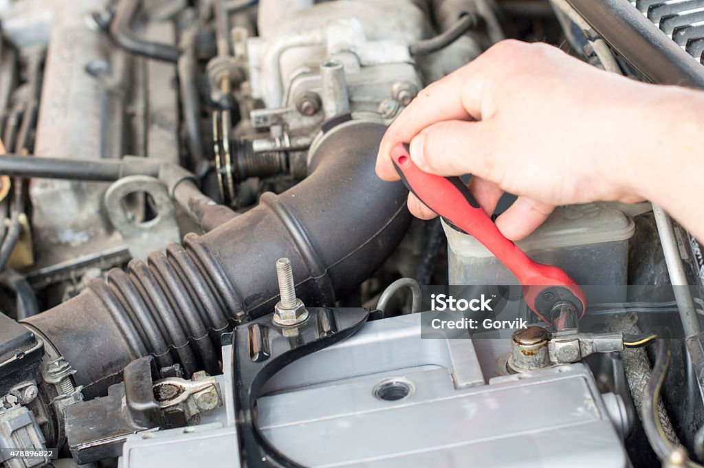 Process of tightening bolts to fix The process of tightening bolts to fix the the vehicle battery 2015 Stock Photo