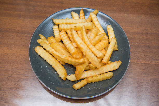 istock French Fries sprinkle salt for dinner 478896934