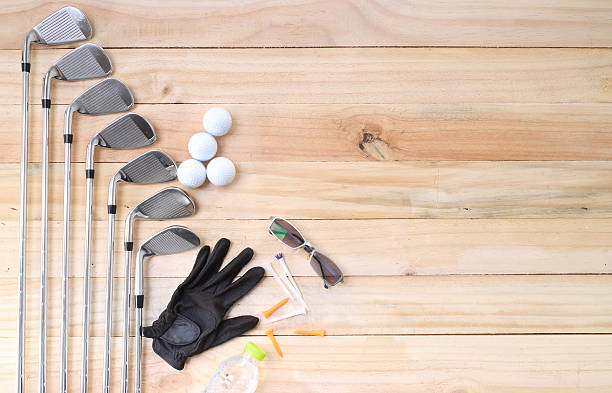 istock Golf equipment on wood floor preparing for good game 478898004